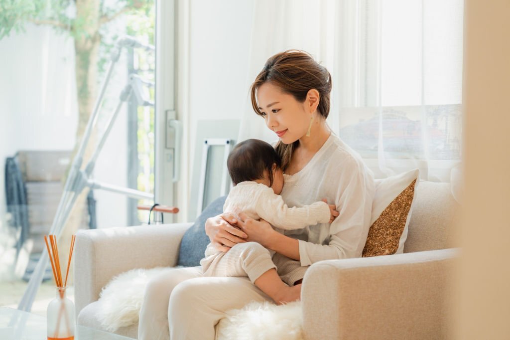 A Mother Living At Home With Her Baby