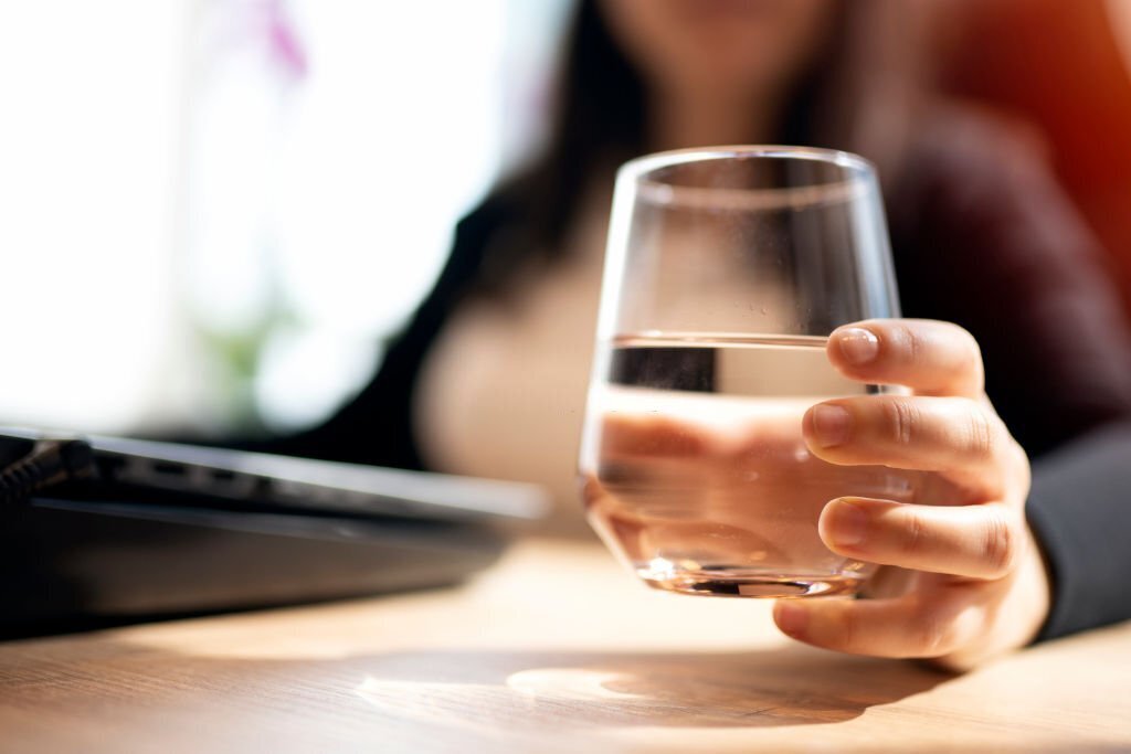 Businesswoman And A Glass Of Water